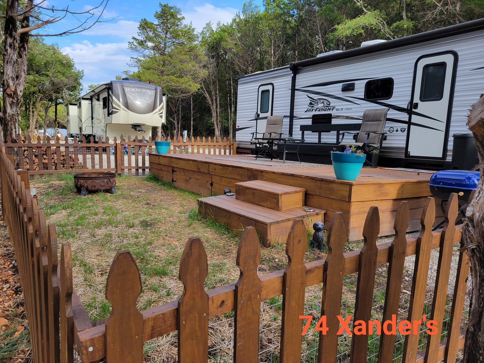 Premium lakeview site 74 with a fifth-wheel RV overlooking the main channel.